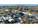 A beautiful aerial view of a neighborhood with blooming trees and a cityscape skyline on a bright day at 3929 Federal Blvd, Denver, CO 80211
