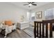 Bedroom with wood-look floors, a rocking chair, a crib, and neutral wall paint at 3929 Federal Blvd, Denver, CO 80211