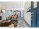 Open-concept living space with modern decor, flowing into the dining and kitchen area at 3929 Federal Blvd, Denver, CO 80211