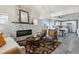 Cozy living room featuring a modern fireplace, comfortable seating, and stylish decor at 3929 Federal Blvd, Denver, CO 80211