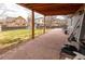 Paved patio with room for outdoor seating and grilling, extends onto a grassy, partially shaded backyard at 5283 E 131St Dr, Thornton, CO 80241