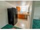 Basement kitchenette with refrigerator, sink, and cabinetry at 5283 E 131St Dr, Thornton, CO 80241