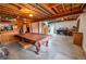 Unfinished basement featuring exposed wood beam ceiling, concrete flooring, and potential recreation space at 5283 E 131St Dr, Thornton, CO 80241