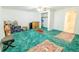 Spacious basement offers lots of space and has vintage rugs on top of the green carpet at 5283 E 131St Dr, Thornton, CO 80241