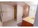 Bathroom featuring a vanity, a mirror with gold fixtures, and a shower stall at 5283 E 131St Dr, Thornton, CO 80241