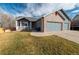 Charming single-Gathering home with a well-manicured lawn and cozy front porch, perfect for relaxation at 5283 E 131St Dr, Thornton, CO 80241