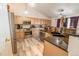 The eat-in kitchen has stainless steel appliances, granite countertops, and ample cabinet space at 5283 E 131St Dr, Thornton, CO 80241
