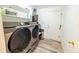 Laundry room featuring modern washer and dryer units at 5283 E 131St Dr, Thornton, CO 80241