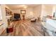 Bright living room featuring a fireplace and an open layout, ideal for gatherings and relaxation at 5283 E 131St Dr, Thornton, CO 80241