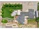 Bird's eye view showing patio, playground, yard, garages, and manicured landscaping at 895 Nile Ct, Golden, CO 80401