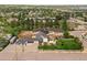 Gorgeous aerial showcasing property with yard, patio, playground, and modern attached home at 895 Nile Ct, Golden, CO 80401