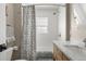 Charming bathroom with a wooden vanity, marble countertop, and modern fixtures at 895 Nile Ct, Golden, CO 80401
