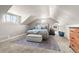 Inviting bedroom under sloped ceilings, featuring carpet, natural light and soothing hues at 895 Nile Ct, Golden, CO 80401