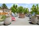 Inviting fire pit area with colorful chairs and decorative planters, perfect for outdoor gatherings at 895 Nile Ct, Golden, CO 80401