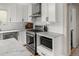 Bright kitchen featuring white cabinetry, stainless steel appliances and marble countertops at 895 Nile Ct, Golden, CO 80401