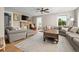 Inviting living room with hardwood floors, a stone fireplace, and comfortable seating at 895 Nile Ct, Golden, CO 80401