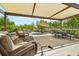 Spacious outdoor patio with covered seating area, garden views, and ample space for entertaining at 895 Nile Ct, Golden, CO 80401