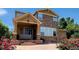 Charming two-story home with a stone facade, covered porch, and beautifully landscaped front yard at 14232 Piney River Rd, Broomfield, CO 80023