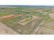 Expansive aerial view of property showcasing land, outbuildings, and neighborhood at 32800 E 137Th Way, Brighton, CO 80603