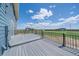 Spacious back deck with black railing overlooking a grassy area, perfect for outdoor entertaining at 32800 E 137Th Way, Brighton, CO 80603