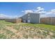 Exterior view of the barn featuring a wooden fence for privacy at 32800 E 137Th Way, Brighton, CO 80603