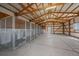 Interior view of a barn featuring multiple dog kennels at 32800 E 137Th Way, Brighton, CO 80603