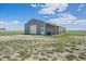 Well-maintained barn/workshop featuring a large door, covered awning, and ample storage space at 32800 E 137Th Way, Brighton, CO 80603