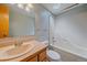 Well-lit bathroom with a combination shower and tub featuring a sink and large mirror at 32800 E 137Th Way, Brighton, CO 80603
