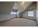 Cozy bedroom featuring two windows, carpet flooring, and slanted ceilings at 32800 E 137Th Way, Brighton, CO 80603