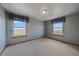 Well-lit bedroom with carpet flooring and windows offering beautiful scenic views at 32800 E 137Th Way, Brighton, CO 80603