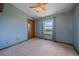 Comfortable bedroom featuring large windows, carpet flooring, and closet space at 32800 E 137Th Way, Brighton, CO 80603