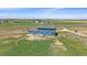 Two-story blue home with a fenced yard, offering great outdoor space in a rural setting at 32800 E 137Th Way, Brighton, CO 80603