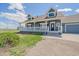 Charming two-story home featuring a welcoming, covered front porch and well-maintained lawn at 32800 E 137Th Way, Brighton, CO 80603