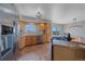 Bright kitchen featuring stainless steel appliances, breakfast bar, and scenic views at 32800 E 137Th Way, Brighton, CO 80603