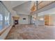 Open-concept living room boasts a fireplace and a staircase leading to the upper level at 32800 E 137Th Way, Brighton, CO 80603