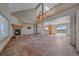 Spacious living room featuring a fireplace, high ceilings, and tile flooring at 32800 E 137Th Way, Brighton, CO 80603