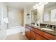Bathroom featuring a double vanity, granite countertops, and a tiled shower-tub combo at 1975 N Grant St # 810, Denver, CO 80203