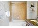 Well-lit bathroom featuring decorative tile, bath tub, shelving, and neutral colors at 1975 N Grant St # 810, Denver, CO 80203