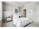 Comfortable bedroom with a plush bed, soft lighting, and access to an ensuite bathroom at 1975 N Grant St # 810, Denver, CO 80203