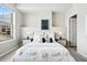 Inviting bedroom with natural light, carpeted floors, and a minimalist design at 1975 N Grant St # 810, Denver, CO 80203