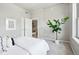 Serene bedroom featuring a large window, a view to an open closet, and a relaxing atmosphere at 1975 N Grant St # 810, Denver, CO 80203