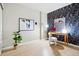 Brightly lit bedroom featuring a unique floral wallpaper design, desk, and decor at 1975 N Grant St # 810, Denver, CO 80203