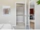 Bedroom closet with closet organizing system, leading to the living and kitchen area at 1975 N Grant St # 810, Denver, CO 80203