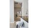 This modern hallway leads to a well-lit room, with sleek design and a decorative tote bag hanging on the wall at 1975 N Grant St # 810, Denver, CO 80203