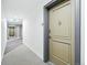 Hallway view featuring unit entrance and neutral color carpet and walls at 1975 N Grant St # 810, Denver, CO 80203