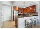 The kitchen features stainless appliances, granite countertops and bar stool seating, offering style and convenience at 1975 N Grant St # 810, Denver, CO 80203