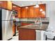 The kitchen boasts stainless steel appliances, granite countertops, and ample cabinet space, perfect for cooking and storage at 1975 N Grant St # 810, Denver, CO 80203
