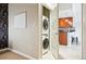 Efficiently stacked washer and dryer laundry setup with a view to the kitchen at 1975 N Grant St # 810, Denver, CO 80203