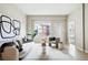 Cozy living room with contemporary furniture, large window, and plenty of natural light at 1975 N Grant St # 810, Denver, CO 80203