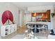 Open-concept living and dining area with modern decor and stainless steel appliances in the kitchen at 1975 N Grant St # 810, Denver, CO 80203